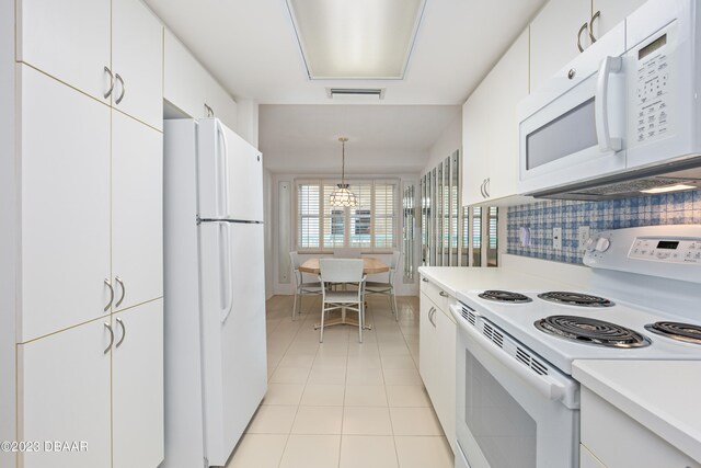 kitchen with white cabinets and white appliances