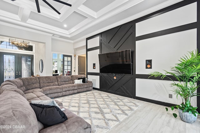 living room with french doors, ornamental molding, coffered ceiling, beam ceiling, and hardwood / wood-style flooring