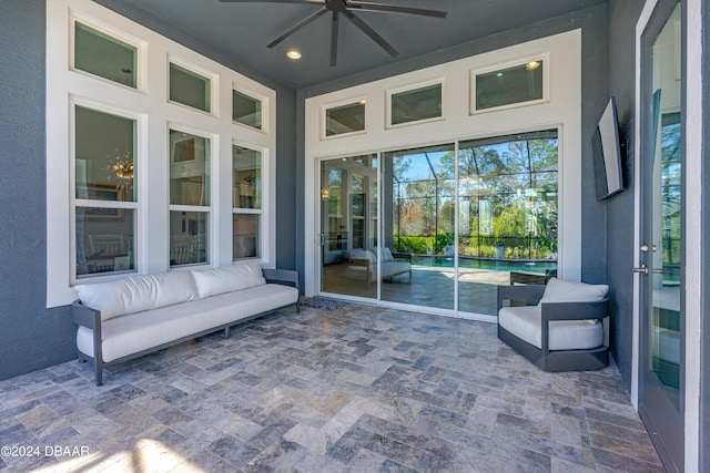 sunroom / solarium with ceiling fan