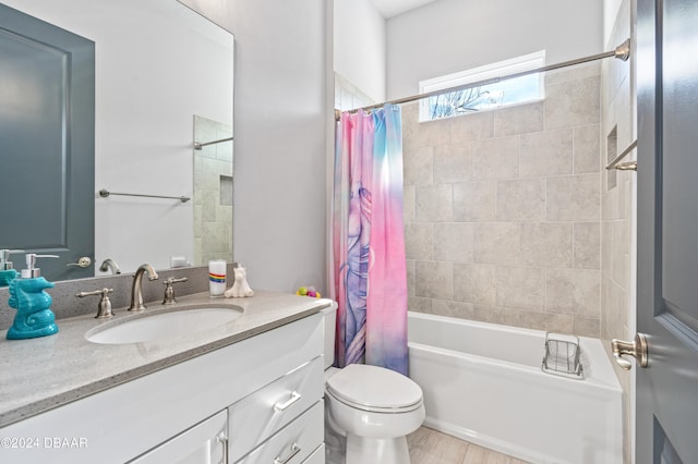 full bathroom with hardwood / wood-style floors, vanity, toilet, and shower / bathtub combination with curtain