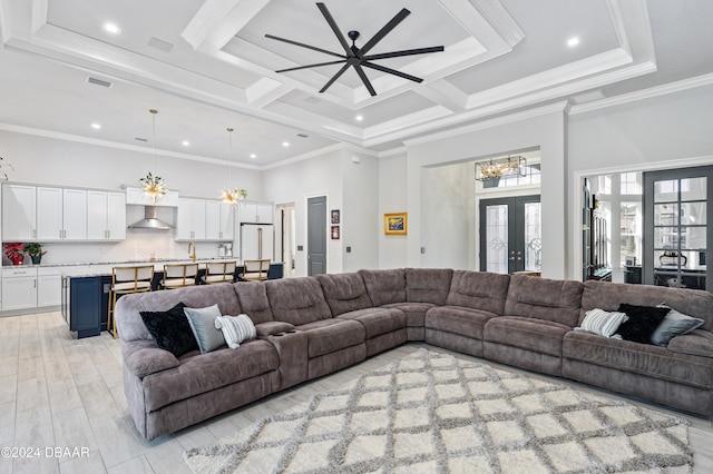 living room featuring french doors, light hardwood / wood-style flooring, ceiling fan, and ornamental molding