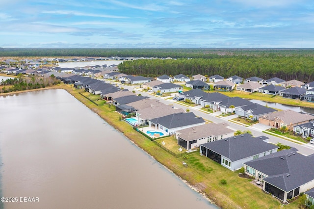 aerial view with a residential view and a water view