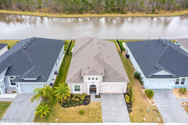 birds eye view of property with a water view