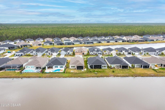 aerial view featuring a residential view and a water view