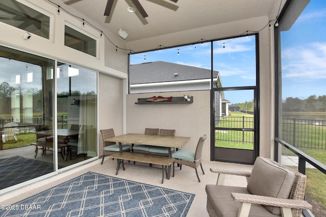 sunroom with a ceiling fan