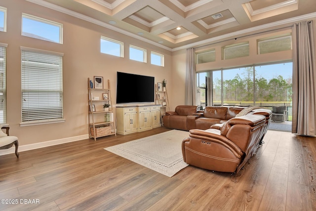 living room featuring light wood finished floors, crown molding, beam ceiling, a towering ceiling, and coffered ceiling