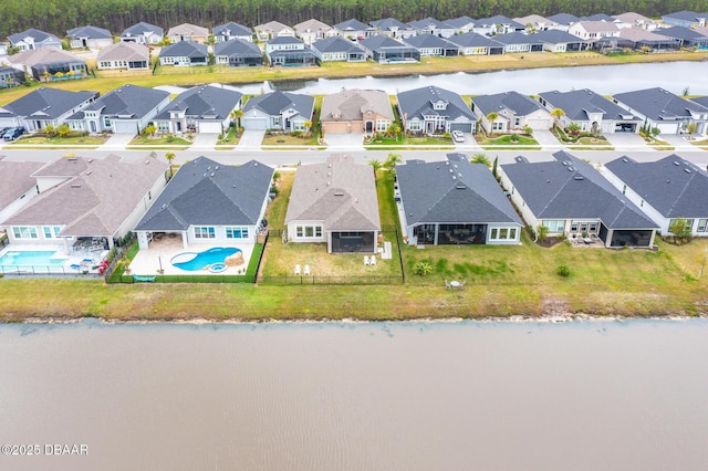 aerial view with a residential view and a water view