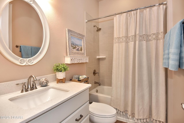 bathroom featuring vanity, toilet, and shower / tub combo