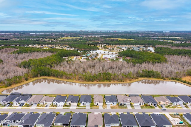 drone / aerial view featuring a residential view and a water view