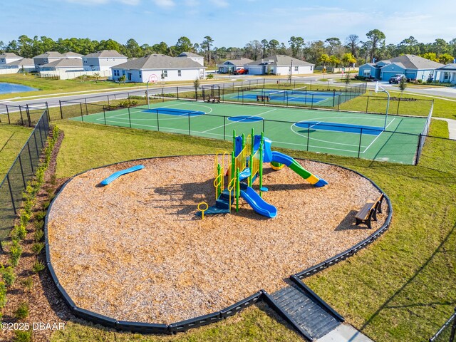 view of sport court featuring a playground