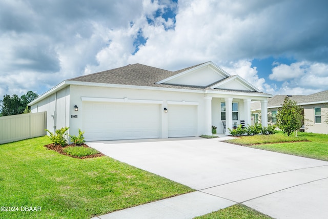 view of front facade featuring a garage and a front yard