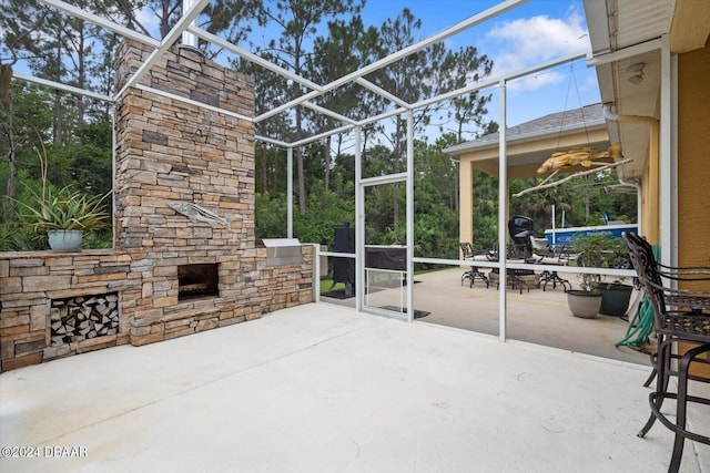 view of patio featuring an outdoor stone fireplace