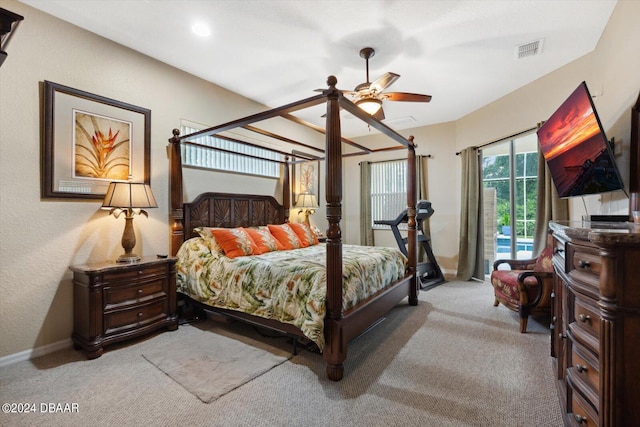 bedroom with ceiling fan, access to exterior, and carpet