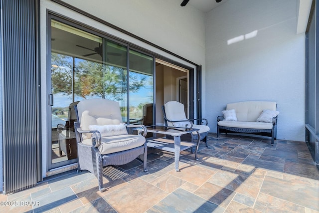 view of patio featuring ceiling fan