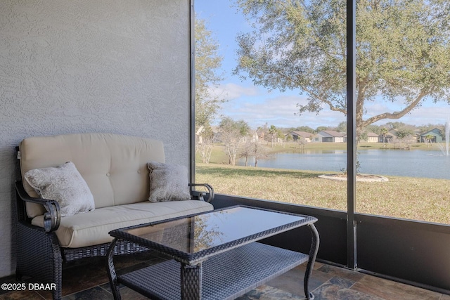 sunroom with a water view