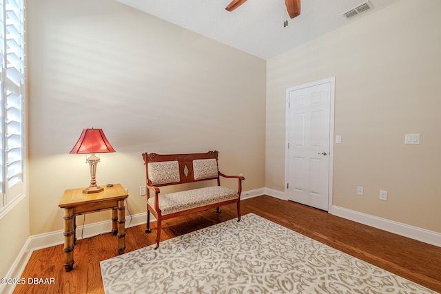 living area featuring ceiling fan, a healthy amount of sunlight, and hardwood / wood-style floors