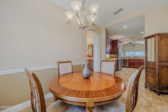 dining room with lofted ceiling and ceiling fan with notable chandelier