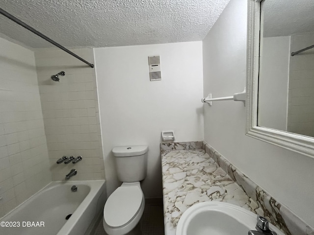 1504 Virginia Ave Unit 112, Daytona Beach, FL 32114 - full bathroom with a textured ceiling, marble finish flooring, bathing tub / shower combination, toilet, and vanity