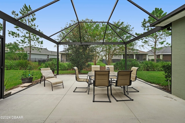 view of patio / terrace featuring glass enclosure