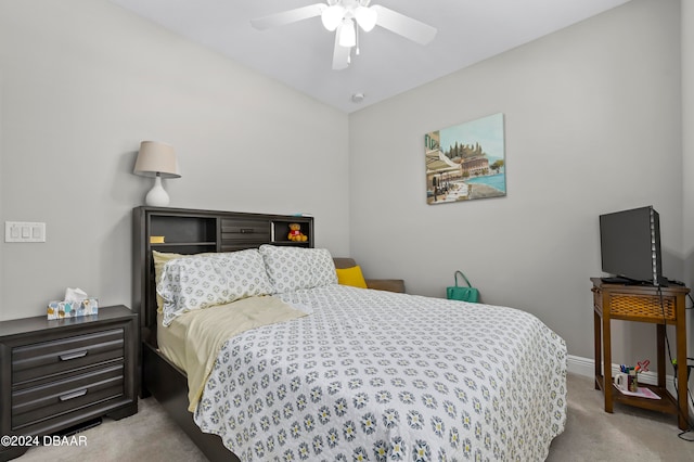 bedroom featuring light colored carpet and ceiling fan