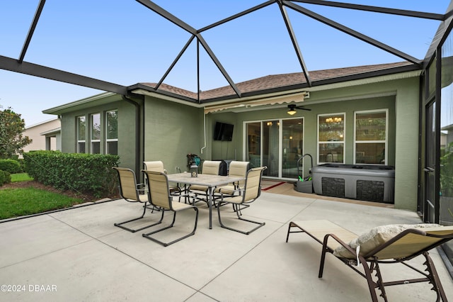 exterior space with glass enclosure and ceiling fan