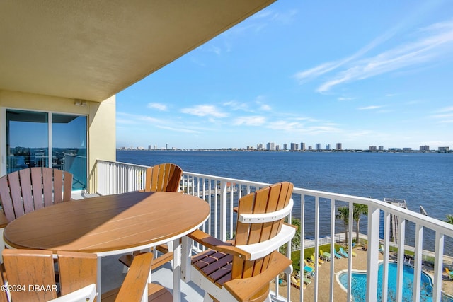 balcony featuring a water view