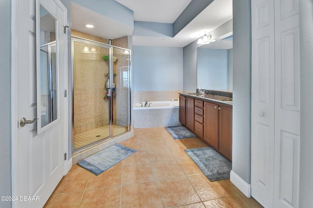 2801 S Ridgewood Ave Unit 608, South Daytona, FL 32119 - bathroom with a shower stall, a bath, tile patterned floors, and vanity
