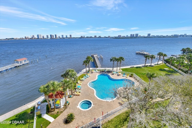 exterior space with a patio, a water view, and a boat dock