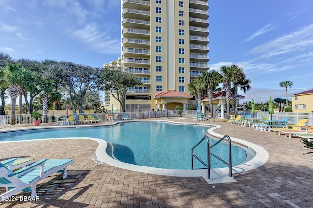 view of swimming pool featuring a patio area