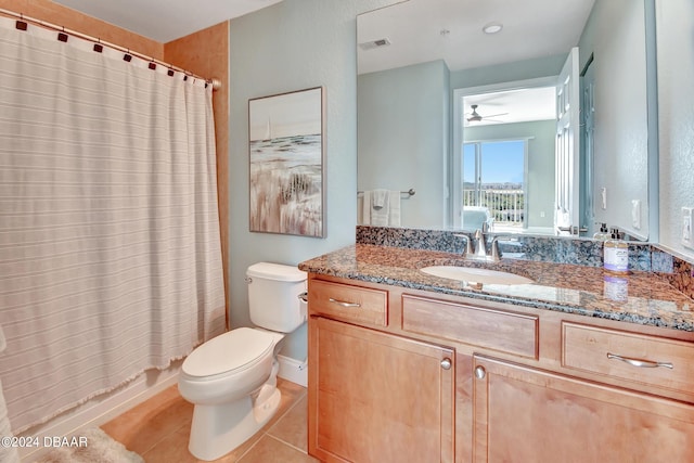 full bathroom featuring shower / bath combination with curtain, ceiling fan, vanity, tile patterned floors, and toilet