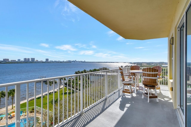 balcony featuring a water view