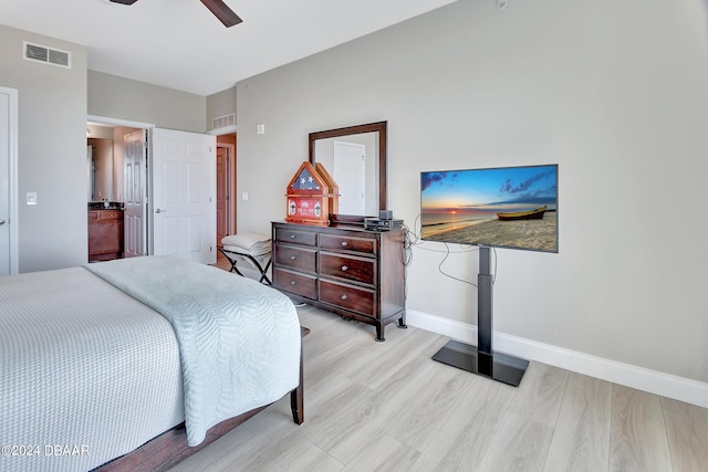 bedroom with light hardwood / wood-style flooring and ceiling fan