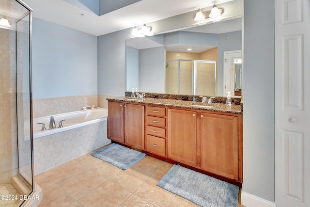 bathroom with vanity, tile patterned floors, and shower with separate bathtub