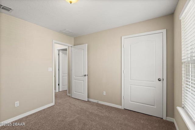 142 Aston Grande Dr, Daytona Beach, FL 32124 - unfurnished bedroom featuring carpet and baseboards