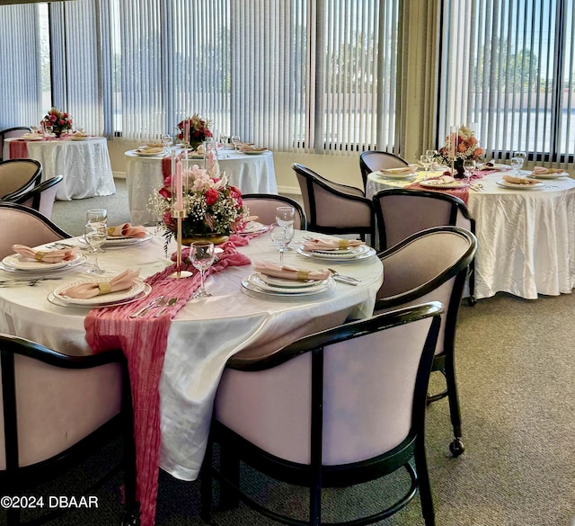 dining area featuring carpet floors and a wealth of natural light