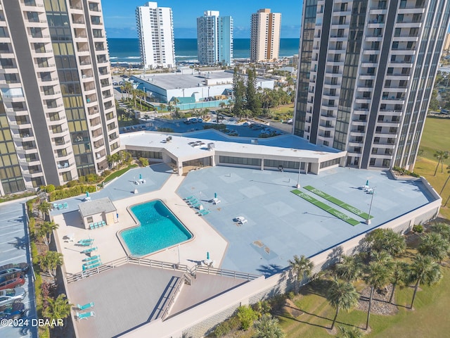 birds eye view of property with a water view