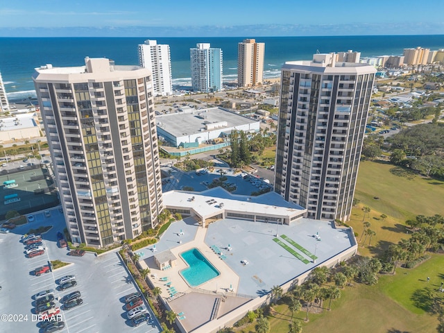 birds eye view of property with a water view