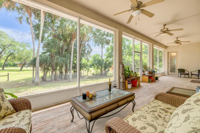 2710 Quiet Ln, Cocoa, FL 32926 - sunroom featuring a ceiling fan and hardwood / wood-style flooring