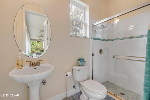 2710 Quiet Ln, Cocoa, FL 32926 - bathroom with baseboards, plenty of natural light, a stall shower, and toilet