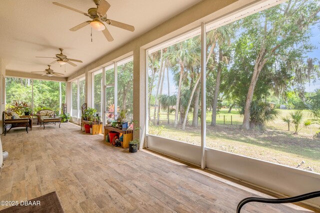 2710 Quiet Ln, Cocoa, FL 32926 - sunroom / solarium with a ceiling fan, wood finished floors, and a wealth of natural light