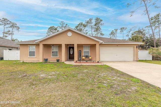 ranch-style house featuring covered porch, a front yard, and a garage