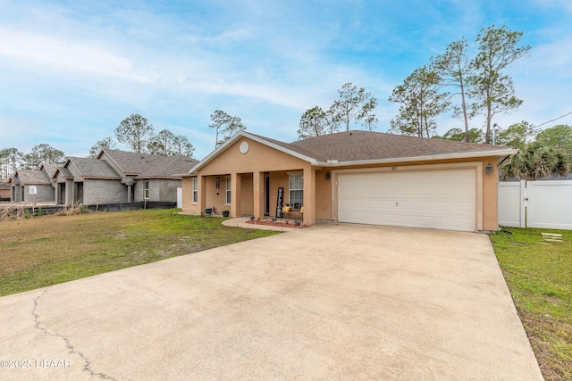 ranch-style home with a garage and a front lawn