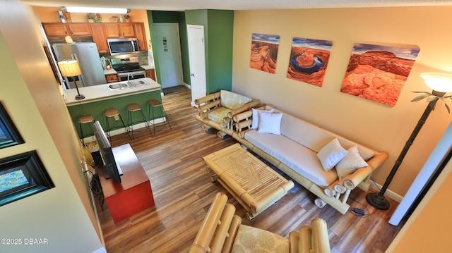 1401 S Palmetto Ave Unit 402, Daytona Beach, FL 32114 - living area featuring wood finished floors and baseboards