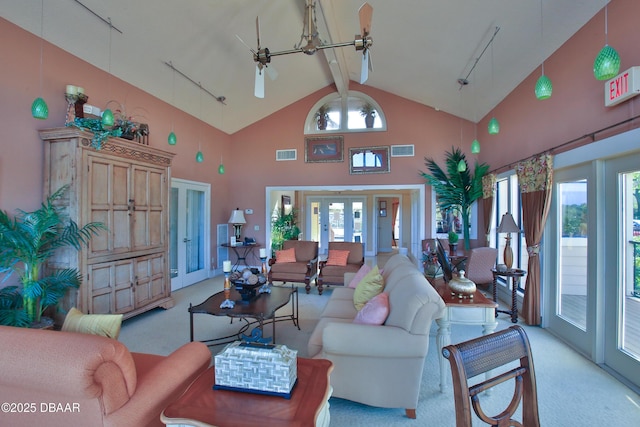 1401 S Palmetto Ave Unit 402, Daytona Beach, FL 32114 - living room featuring light carpet, high vaulted ceiling, beamed ceiling, french doors, and track lighting