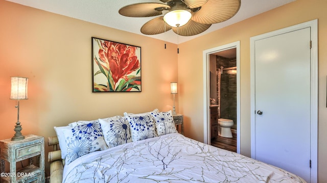 1401 S Palmetto Ave Unit 402, Daytona Beach, FL 32114 - bedroom featuring connected bathroom, wood finished floors, and ceiling fan