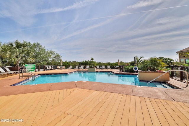 1401 S Palmetto Ave Unit 402, Daytona Beach, FL 32114 - community pool featuring a wooden deck