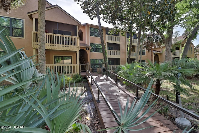 1401 S Palmetto Ave Unit 402, Daytona Beach, FL 32114 - view of building exterior featuring stairway