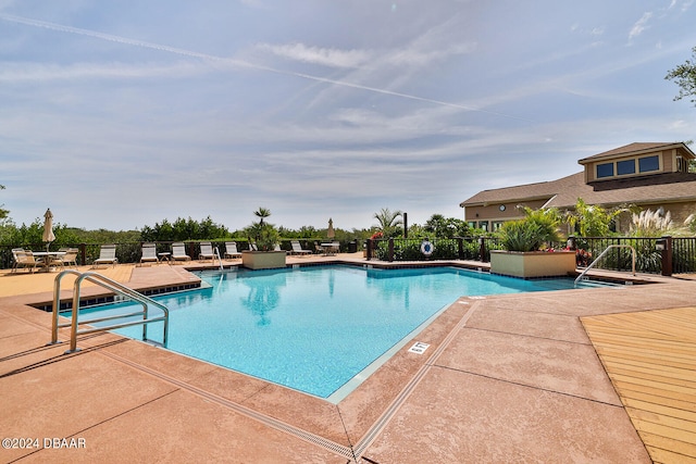 view of pool featuring a patio area