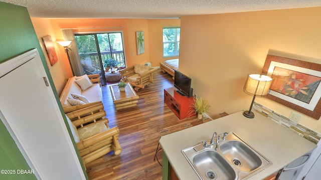 1401 S Palmetto Ave Unit 402, Daytona Beach, FL 32114 - living area with a textured ceiling and wood finished floors