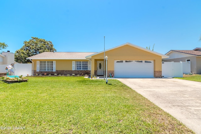 single story home featuring a front lawn and a garage